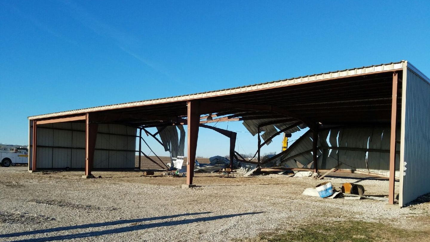 Picture of metal farm building torn apart